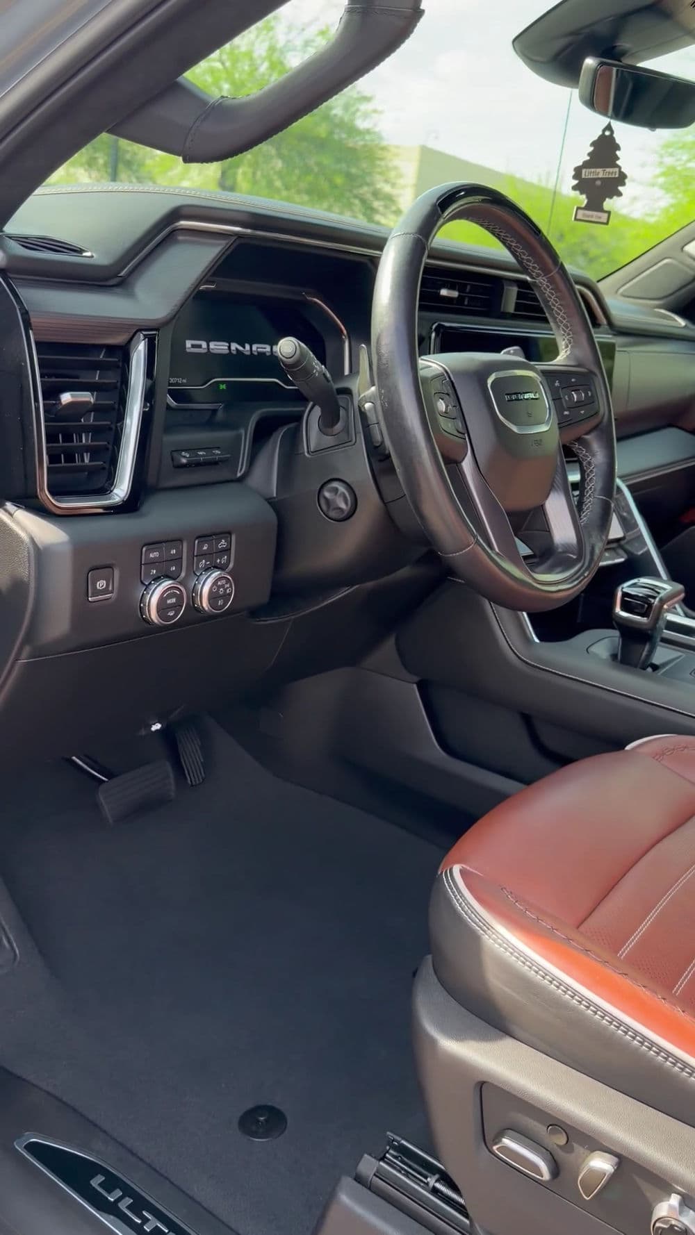 Luxury SUV interior with leather seats, advanced controls, and modern design elements.