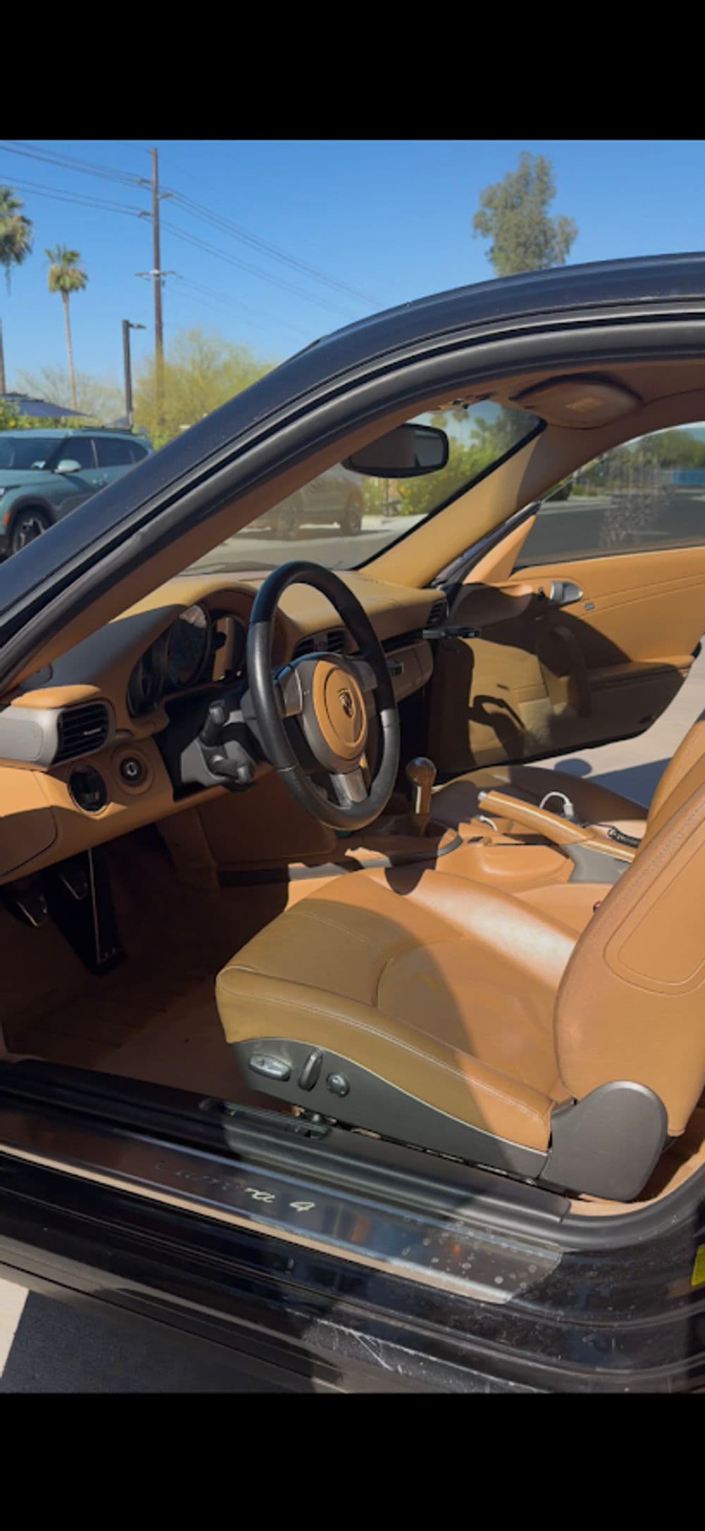 Interior of a luxury car featuring leather seats and modern dashboard design.
